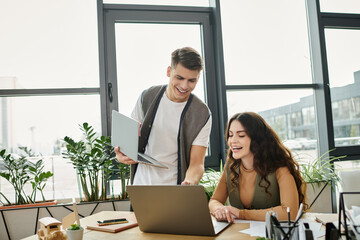 Wall Mural - Two colleagues engage positively while in office.