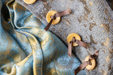 Textile luxury background velour, silk and buttons with bows