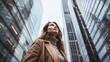© Cloudyew - Woman in front of a skyscraper she owns.
