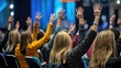 © Budi - Backside perspective of attendees raising hands at a conference
