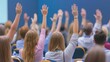 © Budi - Backside perspective of attendees raising hands at a conference