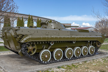 Wall Mural - Tracked infantry fighting vehicle for the transportation of personnel. A Russian armored combat vehicle for transporting soldiers and fire support. Аrmored combat vehicle.