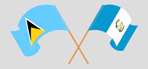 Wall Mural - Crossed and waving flags of Saint Lucia and Republic of Guatemala