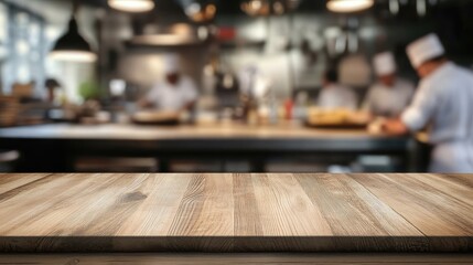 Wall Mural - wooden table and busy chefs working on the restaurant kitchen , blurred background. Foods display banner