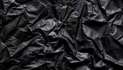 Aufkleber - Textured Black Wrinkled Paper. Close-Up of Crumpled Black Fabric Material with Intricate Fold Patterns and Subtle Light Reflections