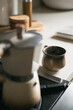 © Mackenzie Duncan/Stocksy - Stove top espresso with mug in the background