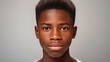 © ALA - Portrait of a happy cheerful serious, troubled African American teenager guy with perfect skin, white background, banner.