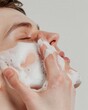 © Steveandfriend - Beauty and cleanser Man washing face with a gentle cleanser, focusing on habitual skincare