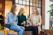 © Oleksii Syrotkin/Stocksy - Grandmother, mother with coffee and daughter in mall in free time