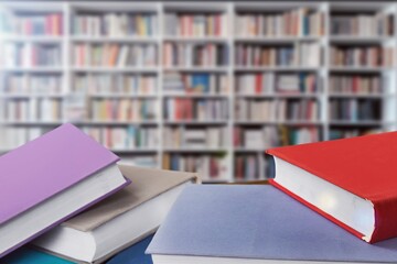 Canvas Print - pile of reading books on table in library, education