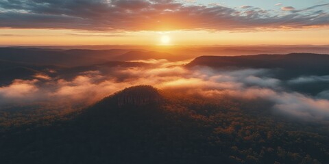 Sticker - A stunning vista from a mountain summit at sunrise, revealing the splendor of pristine nature in all its glory.