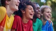 © Johannes - A group of young people wearing different colored shirts are laughing together
