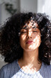 © mahalo studio/Stocksy - woman enjoying sunlight with eyes closed