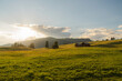 © Anna Tsukanova/Stocksy - Scenic view of sunny meadow in Dolomites at sunset a