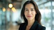© Business Pics - Headshot close up portrait of latin hispanic confident mature good looking middle age leader, ceo female businesswoman on blur office background. Gorgeous beautiful business woman smiling at camera