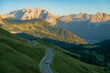 © Anna Tsukanova/Stocksy - Car on winding road through Alps