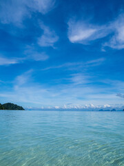 Wall Mural - Landscape beautiful summer vertical horizon look view tropical shore open sea beach cloud clean  blue sky background calm nature ocean wave water nobody travel at Koh Kradan Trang Thailand day time