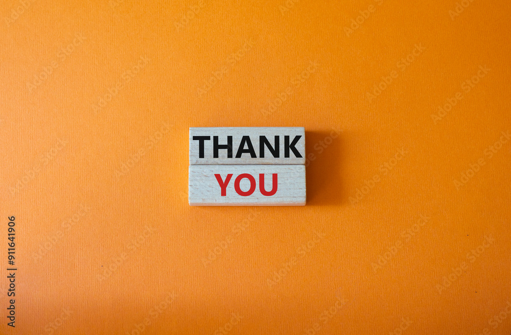 Thank you symbol. Wooden blocks with words Thank you. Beautiful orange ...