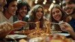 © Business Pics - Group of close friends happily eating pasta
