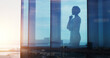 © peopleimages.com - Silhouette, woman or thinking at window for business, reflection or idea for company growth in office. Female CEO, brainstorming or plan in workplace for leadership inspiration in future investment