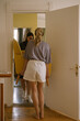 © Alina Hvostikova/Stocksy - Couple moving couch into new apartment