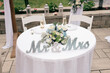 © Lea Jones/Stocksy - bridal table at backyard wedding reception