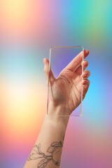 Cropped female holding glass imitating vertical portable computer