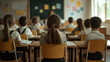 © Maksym - Schoolchildren sitting at desks, attentively listening to their teacher