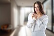© BillionPhotos.com - Young beautiful woman drinking coffee in living room