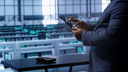 Poster - Technician in server hub workplace installing newly ordered storage unit, checking parameters with tablet. IT expert in data center holding device, replacing storage mainframes components, camera A