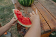 © Anna Artemenko/Stocksy - child's hands with a slice of watermelon