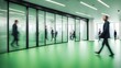 © Hastuti - people walking on green office space, motion blur effect, environment concept