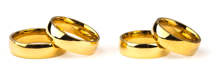 four gold rings on a white background