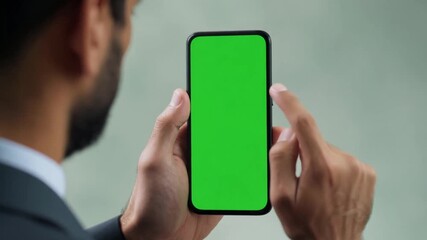 Poster - man browsing social networks on smartphone with green mockup screen generative ai