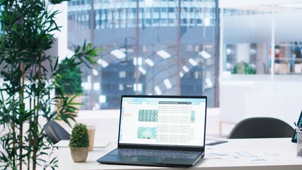 Poster - Laptop screen in office showing stock exchange indices changing in real time. Notebook in workspace with forex trading indexes displayed live showing latest price modifications