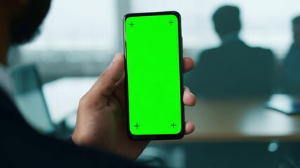 Poster - Close Up of Man Holding Smartphone With Green Screen in Office Generative AI