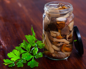 Sticker - Mix of chopped marinated forest mushrooms in glass jar, homemade preserves