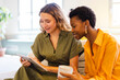 © Nuria Seguí/Stocksy - Female Entrepreneurs Working Together Modern In Office