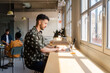 © Nuria Seguí/Stocksy - Male Entrepreneur Working On Laptop In Modern Workplace