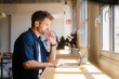 © Nuria Seguí/Stocksy - Male Entrepreneur Working On Laptop In Modern Workplace