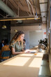 © Nuria Seguí/Stocksy - Businesswoman Working On Laptop In Modern Workplace