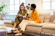 © Nuria Seguí/Stocksy - Female Teamwork Working Together Modern In Office