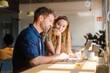 © Nuria Seguí/Stocksy - Businesspeople Working Together With Laptop In Modern Workplace