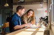 © Nuria Seguí/Stocksy - Businesspeople Working Together With Laptop In Modern Workplace