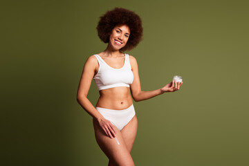 Poster - No retouch photo of pretty cute lady underwear lingerie applying body lotion emtpy space isolated green color background