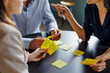 © BONNINSTUDIO/Stocksy - Business team brainstorming new ideas using sticky notes