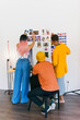© VICTOR TORRES/Stocksy - Team brainstorming and photo selection in creative workspace