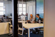 © BONNINSTUDIO/Stocksy - Businessmen discussing work in modern office