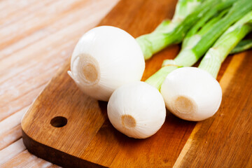 Canvas Print - Vegetable ingredients for cooking, organic spring onion on wooden table