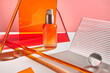 © Tatyana Lavrova/Stocksy - Cosmetic bottle with face serum among colorful geometric figures